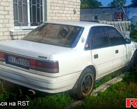 Белый Мазда Капелла, объемом двигателя 1.8 л и пробегом 520 тыс. км за 700 $, фото 1 на Automoto.ua