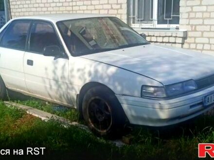 Белый Мазда Капелла, объемом двигателя 1.8 л и пробегом 520 тыс. км за 700 $, фото 1 на Automoto.ua