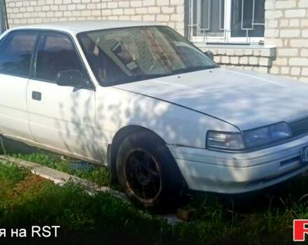 Білий Мазда Капелла, об'ємом двигуна 1.8 л та пробігом 520 тис. км за 700 $, фото 1 на Automoto.ua