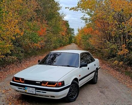 Белый Мазда Капелла, объемом двигателя 2 л и пробегом 150 тыс. км за 1500 $, фото 1 на Automoto.ua