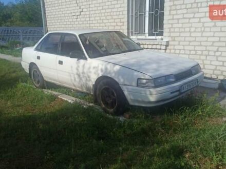 Белый Мазда Капелла, объемом двигателя 1.79 л и пробегом 450 тыс. км за 700 $, фото 1 на Automoto.ua