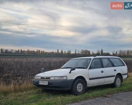 Белый Мазда Капелла, объемом двигателя 1.6 л и пробегом 154 тыс. км за 3000 $, фото 1 на Automoto.ua