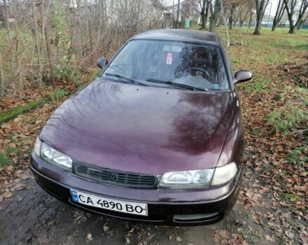 Фиолетовый Мазда Кронос, объемом двигателя 2 л и пробегом 250 тыс. км за 1700 $, фото 2 на Automoto.ua