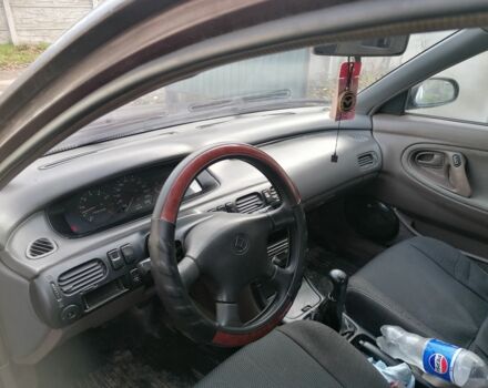 Фиолетовый Мазда Кронос, объемом двигателя 2 л и пробегом 250 тыс. км за 1700 $, фото 3 на Automoto.ua