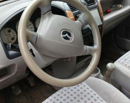 Черный Мазда Демио, объемом двигателя 1.5 л и пробегом 280 тыс. км за 2500 $, фото 5 на Automoto.ua