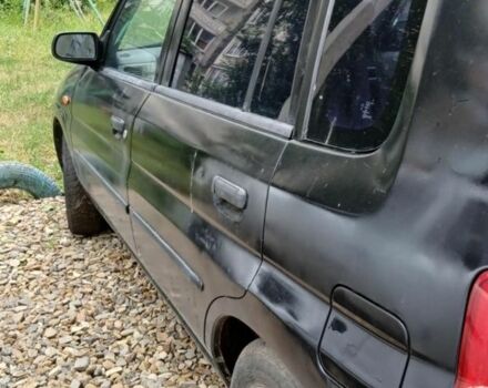 Черный Мазда Демио, объемом двигателя 1.5 л и пробегом 280 тыс. км за 2500 $, фото 1 на Automoto.ua