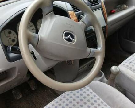 Черный Мазда Демио, объемом двигателя 1.5 л и пробегом 280 тыс. км за 2500 $, фото 4 на Automoto.ua