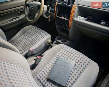 Черный Мазда Демио, объемом двигателя 1.5 л и пробегом 280 тыс. км за 2500 $, фото 8 на Automoto.ua