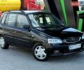 Черный Мазда Демио, объемом двигателя 1.5 л и пробегом 300 тыс. км за 2700 $, фото 1 на Automoto.ua