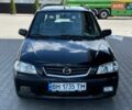 Черный Мазда Демио, объемом двигателя 1.5 л и пробегом 300 тыс. км за 2700 $, фото 2 на Automoto.ua