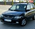 Черный Мазда Демио, объемом двигателя 1.5 л и пробегом 300 тыс. км за 2700 $, фото 1 на Automoto.ua