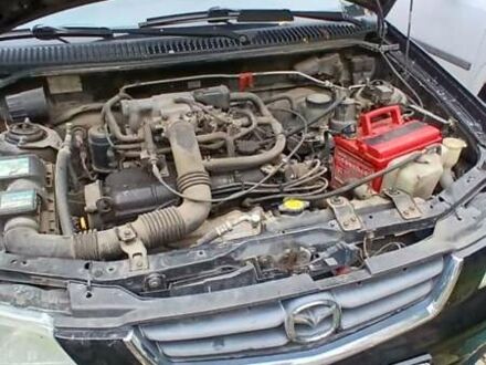 Черный Мазда Демио, объемом двигателя 1.5 л и пробегом 280 тыс. км за 2500 $, фото 1 на Automoto.ua