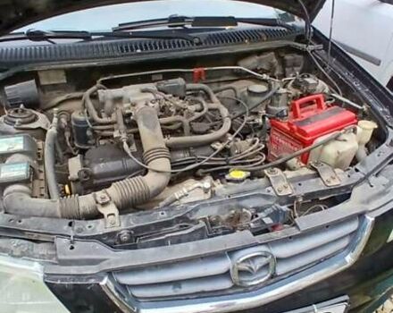 Черный Мазда Демио, объемом двигателя 1.5 л и пробегом 280 тыс. км за 2500 $, фото 1 на Automoto.ua