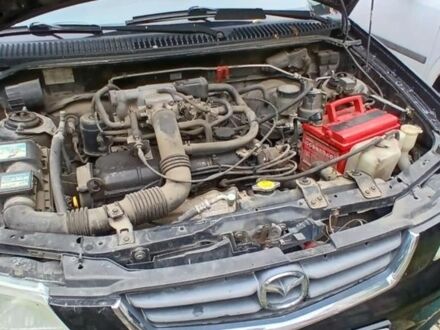 Черный Мазда Демио, объемом двигателя 1.5 л и пробегом 280 тыс. км за 2500 $, фото 1 на Automoto.ua