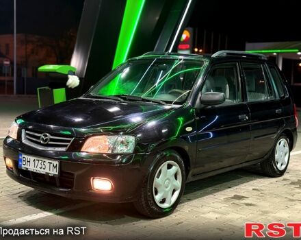 Черный Мазда Демио, объемом двигателя 1.5 л и пробегом 300 тыс. км за 2700 $, фото 1 на Automoto.ua