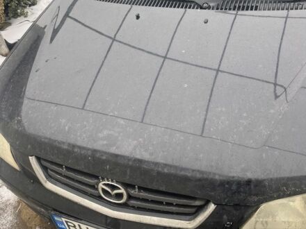 Чорний Мазда Деміо, об'ємом двигуна 1.5 л та пробігом 258 тис. км за 1200 $, фото 1 на Automoto.ua