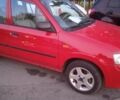 Красный Мазда Демио, объемом двигателя 1.5 л и пробегом 197 тыс. км за 3300 $, фото 2 на Automoto.ua