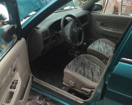 Зеленый Мазда Демио, объемом двигателя 1.3 л и пробегом 180 тыс. км за 1000 $, фото 7 на Automoto.ua