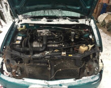 Зеленый Мазда Демио, объемом двигателя 1.3 л и пробегом 180 тыс. км за 1000 $, фото 2 на Automoto.ua