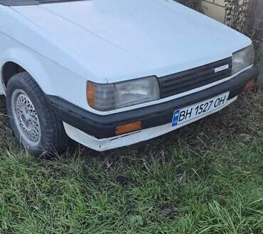 Белый Мазда Фамилия, объемом двигателя 1.5 л и пробегом 1 тыс. км за 700 $, фото 1 на Automoto.ua