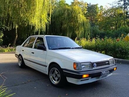 Белый Мазда Фамилия, объемом двигателя 1.5 л и пробегом 136 тыс. км за 5500 $, фото 1 на Automoto.ua