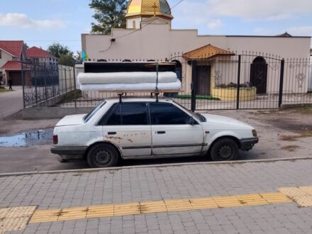 Білий Мазда Фамілія, об'ємом двигуна 0 л та пробігом 496 тис. км за 900 $, фото 1 на Automoto.ua