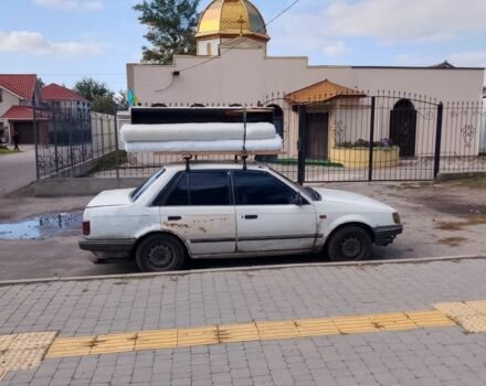 Белый Мазда Фамилия, объемом двигателя 0 л и пробегом 490 тыс. км за 900 $, фото 1 на Automoto.ua