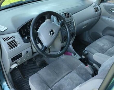 Зеленый Мазда Премаси, объемом двигателя 1.84 л и пробегом 300 тыс. км за 3600 $, фото 4 на Automoto.ua