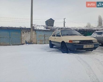 Бежевый Мазда Протеж, объемом двигателя 1.6 л и пробегом 407 тыс. км за 827 $, фото 1 на Automoto.ua