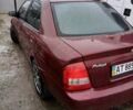 Красный Мазда Протеж, объемом двигателя 1.99 л и пробегом 200 тыс. км за 1500 $, фото 4 на Automoto.ua