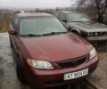 Красный Мазда Протеж, объемом двигателя 1.99 л и пробегом 200 тыс. км за 1500 $, фото 1 на Automoto.ua