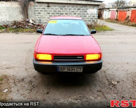 Красный Мазда Протеж, объемом двигателя 1.8 л и пробегом 300 тыс. км за 500 $, фото 1 на Automoto.ua