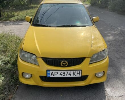Желтый Мазда Протеж, объемом двигателя 2 л и пробегом 210 тыс. км за 3000 $, фото 6 на Automoto.ua