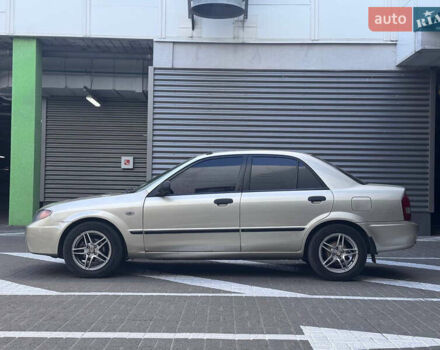 Серый Мазда Протеж, объемом двигателя 2 л и пробегом 85 тыс. км за 3600 $, фото 3 на Automoto.ua