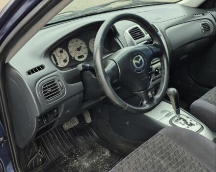 Синій Мазда Протеже, об'ємом двигуна 2 л та пробігом 180 тис. км за 3500 $, фото 14 на Automoto.ua