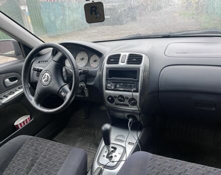 Синий Мазда Протеж, объемом двигателя 2 л и пробегом 298 тыс. км за 3700 $, фото 2 на Automoto.ua