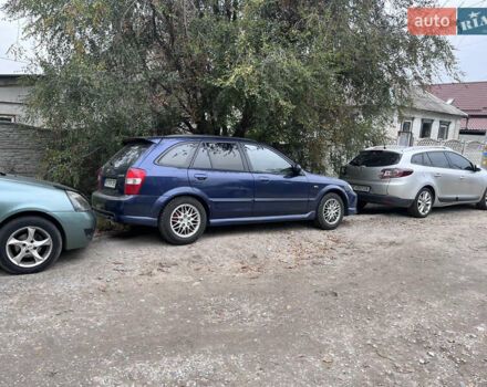 Синій Мазда Протеже, об'ємом двигуна 2 л та пробігом 299 тис. км за 3500 $, фото 7 на Automoto.ua