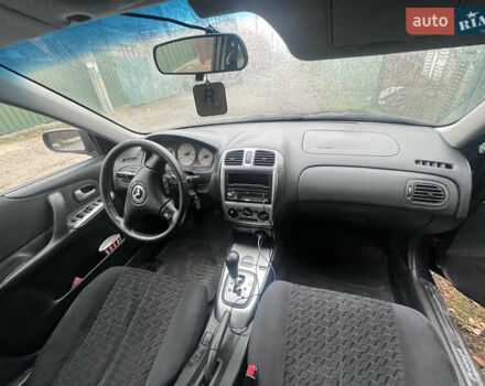 Синій Мазда Протеже, об'ємом двигуна 2 л та пробігом 299 тис. км за 3500 $, фото 10 на Automoto.ua