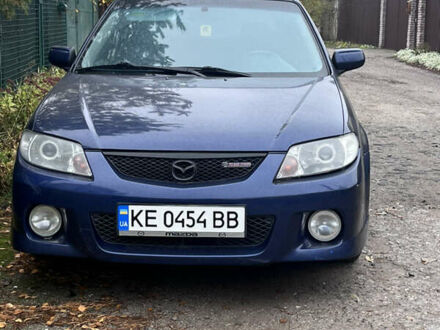 Синий Мазда Протеж, объемом двигателя 2 л и пробегом 299 тыс. км за 3500 $, фото 1 на Automoto.ua