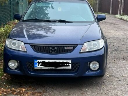 Синий Мазда Протеж, объемом двигателя 2 л и пробегом 298 тыс. км за 3700 $, фото 1 на Automoto.ua