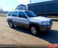 Білий Мазда Трибьют, об'ємом двигуна 3 л та пробігом 304 тис. км за 4999 $, фото 1 на Automoto.ua