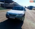 Белый Мазда Трибьют, объемом двигателя 3 л и пробегом 304 тыс. км за 4600 $, фото 1 на Automoto.ua