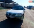 Белый Мазда Трибьют, объемом двигателя 3 л и пробегом 304 тыс. км за 5300 $, фото 1 на Automoto.ua