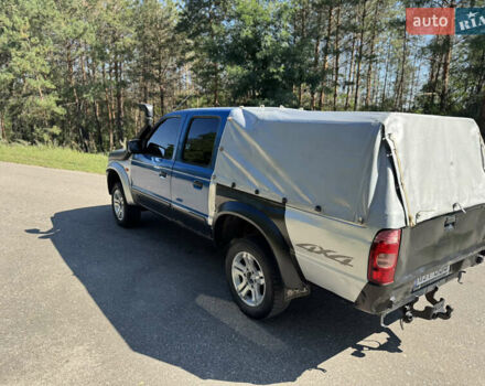 Белый Мазда Трибьют, объемом двигателя 2.5 л и пробегом 387 тыс. км за 4750 $, фото 5 на Automoto.ua