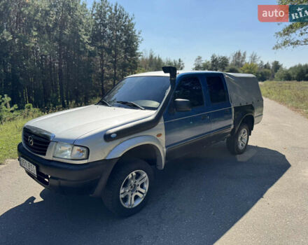Белый Мазда Трибьют, объемом двигателя 2.5 л и пробегом 387 тыс. км за 4750 $, фото 2 на Automoto.ua