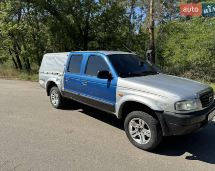 Белый Мазда Трибьют, объемом двигателя 2.5 л и пробегом 387 тыс. км за 4750 $, фото 3 на Automoto.ua