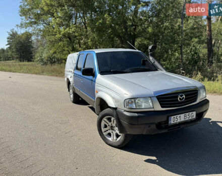 Белый Мазда Трибьют, объемом двигателя 2.5 л и пробегом 387 тыс. км за 4750 $, фото 1 на Automoto.ua