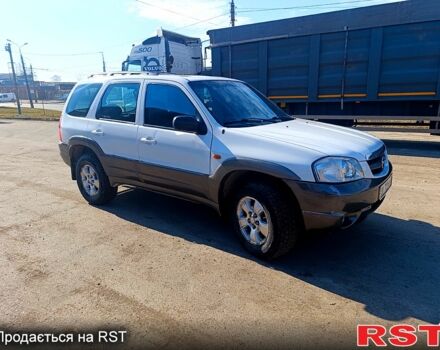 Белый Мазда Трибьют, объемом двигателя 3 л и пробегом 304 тыс. км за 4999 $, фото 1 на Automoto.ua