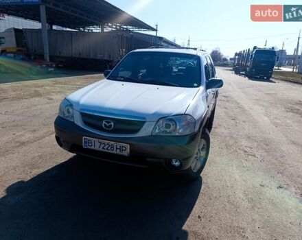 Белый Мазда Трибьют, объемом двигателя 3 л и пробегом 304 тыс. км за 5300 $, фото 1 на Automoto.ua