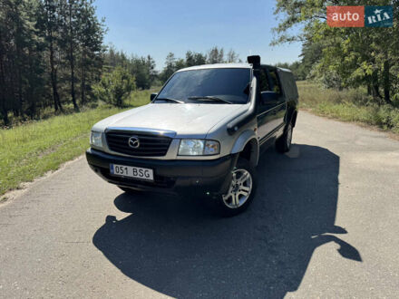 Белый Мазда Трибьют, объемом двигателя 2.5 л и пробегом 387 тыс. км за 4750 $, фото 1 на Automoto.ua